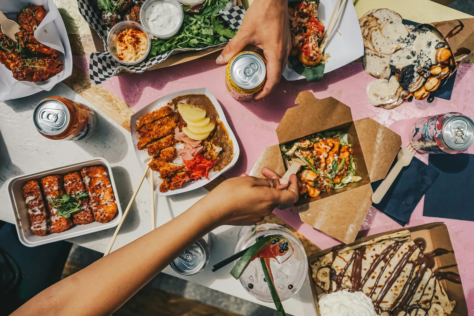 Friends sharing restaurant dishes around a table
